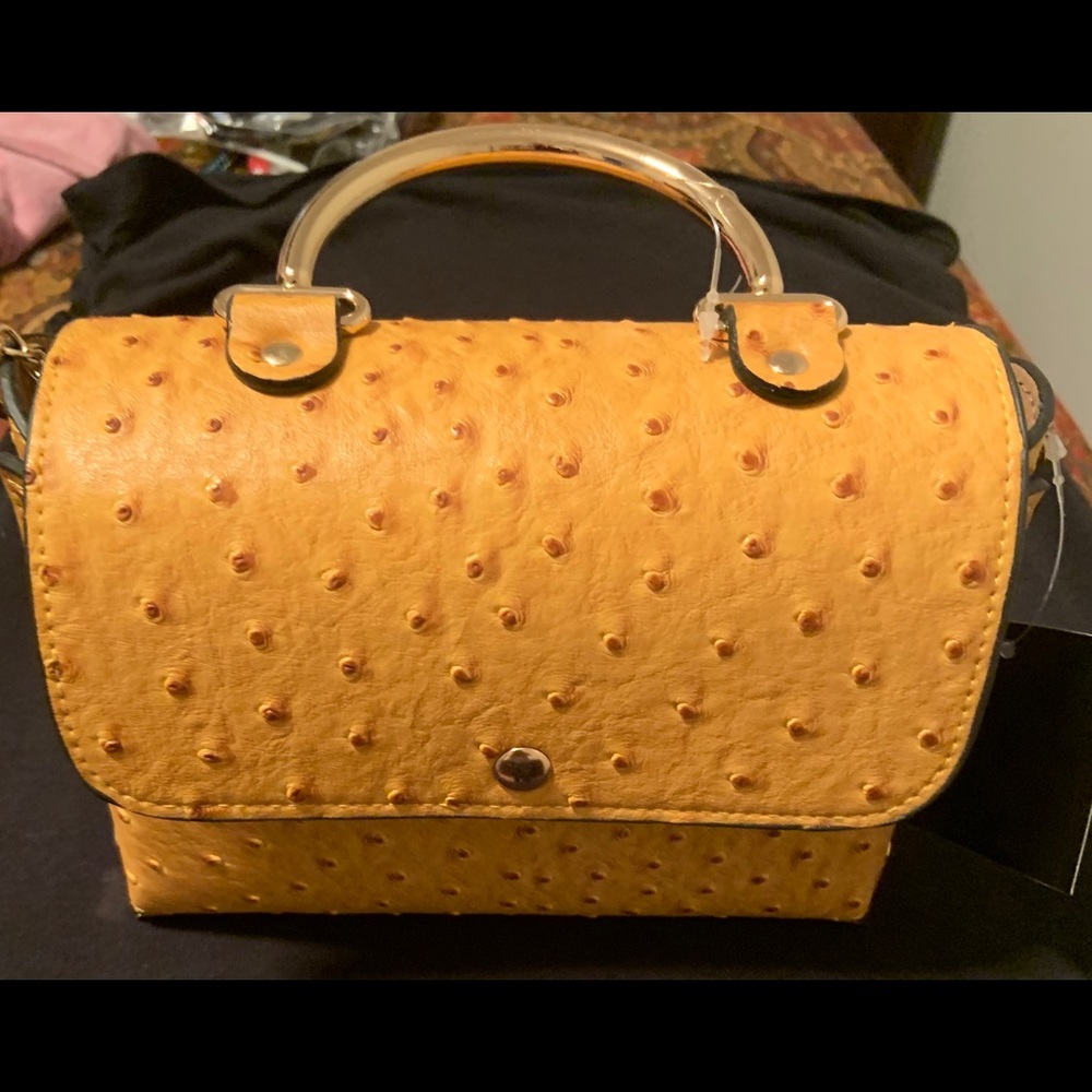 Small purse mustard color with gold accent handle